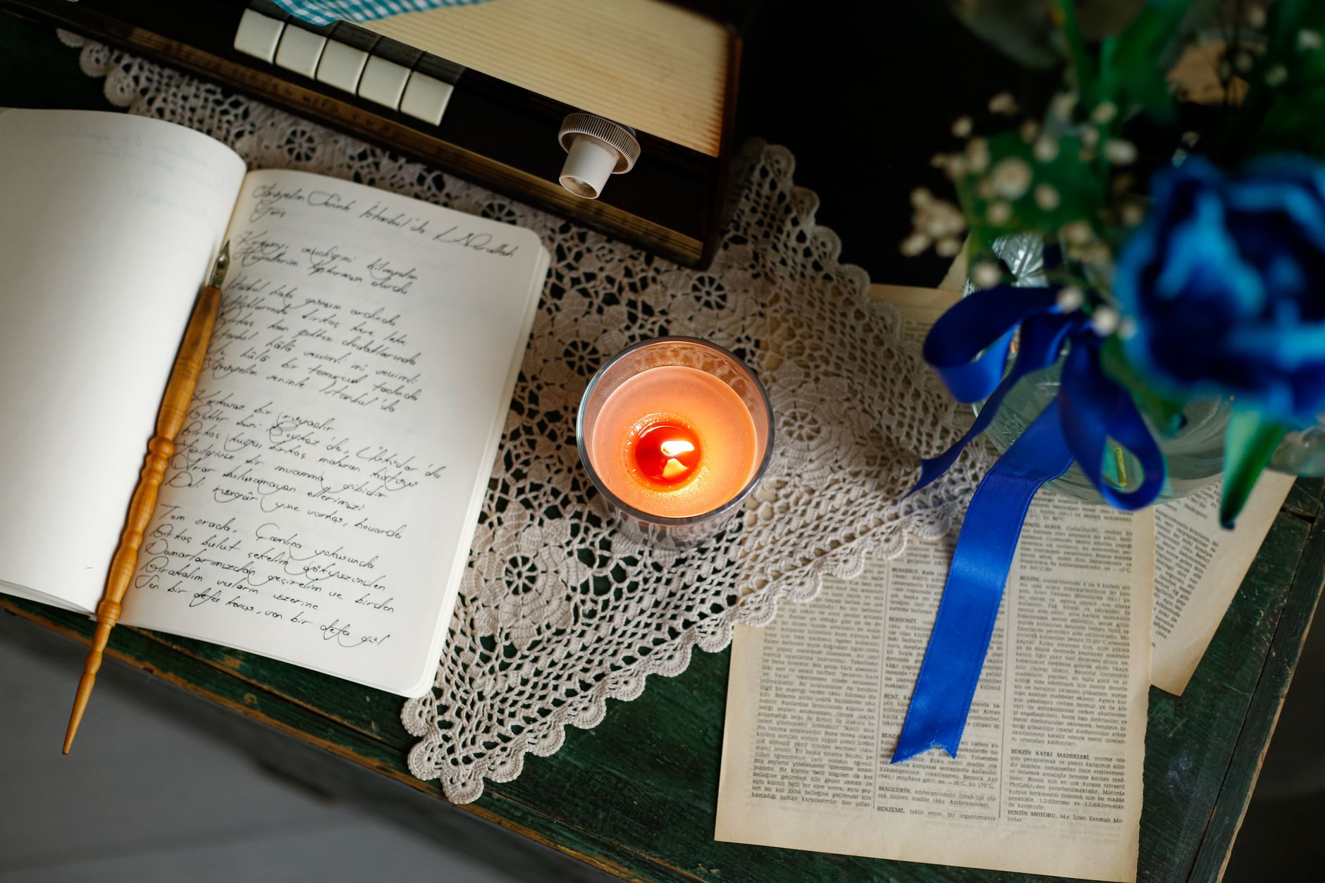 A candlelit writing desk